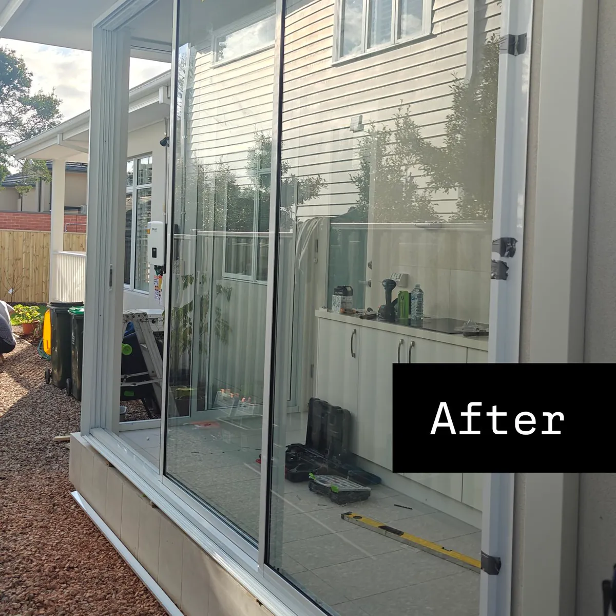 A back porch enclosed with aluminium-framed glass